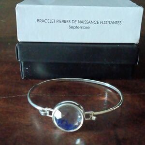 Silvertone bangle bracelet with opening from Avon. September